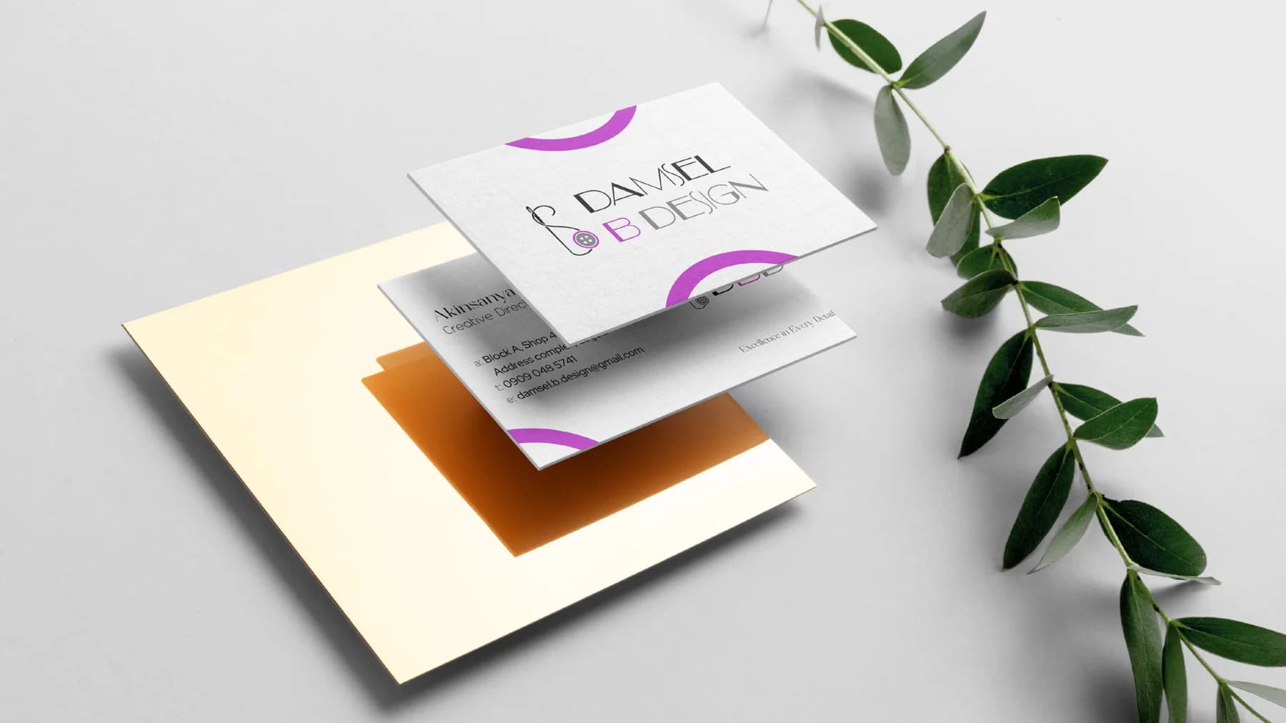 Damsel B Design branded stationery on cream and grey paper